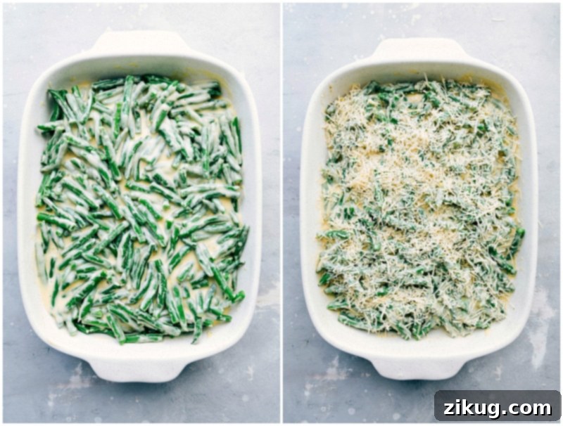 A generous layer of freshly grated sharp Cheddar and Parmesan cheese being sprinkled over the sauced green beans in a casserole dish, prior to baking.
