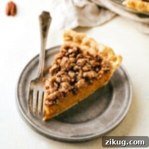 A beautiful Pumpkin Pecan Streusel Pie, freshly baked and ready to be served.