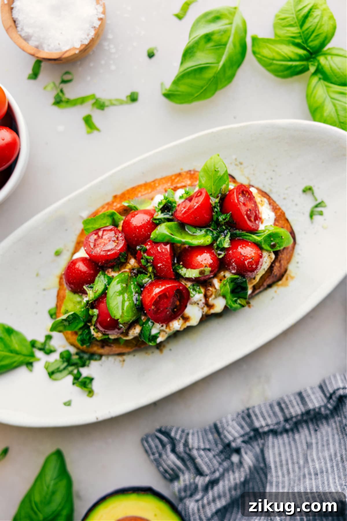 Easy 5-Minute Cottage Cheese Toast 2 Cottage Cheese Toast on a plate with fresh basil and balsamic.