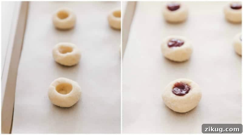 Amazing raspberry-filled and almond-flavored shortbread Thumbprint Cookies are irresistibly good and perfect for a holiday cookie platter! Process shot: A baking sheet with unfilled shortbread cookie dough balls alongside those already filled with vibrant raspberry jam, ready for baking.