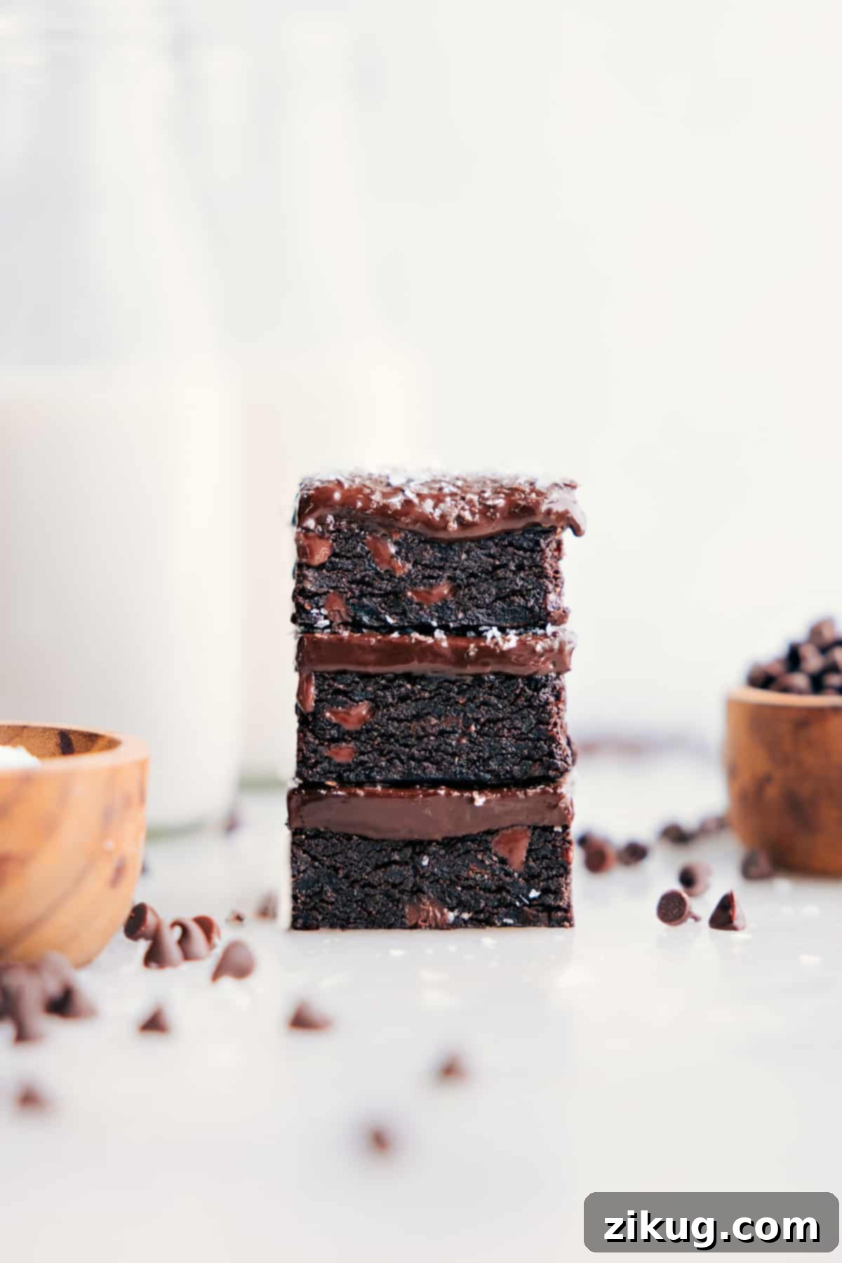 Refined Sugar-Free Date Brownies Fudgy Date Brownies stacked enticingly on top of each other, showcasing their rich texture.