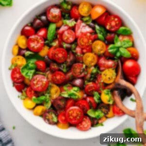 A smaller image of the vibrant tomato salad with fresh basil.