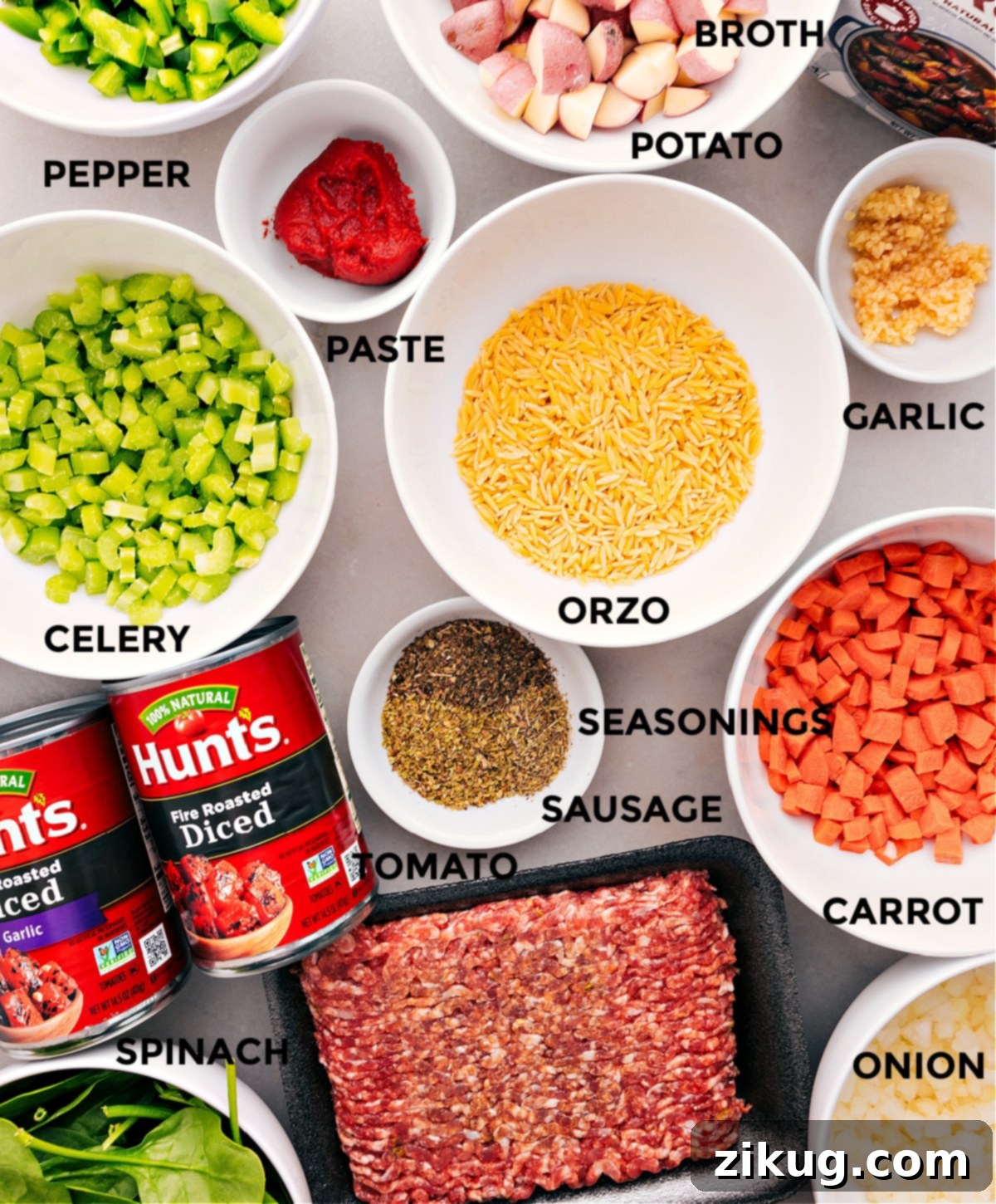 Essential Ingredients for Italian Sausage Orzo Soup All fresh ingredients for Italian Sausage Orzo Soup laid out: pasta, ground Italian sausage, an assortment of chopped vegetables, rich beef broth, and flavorful seasonings.
