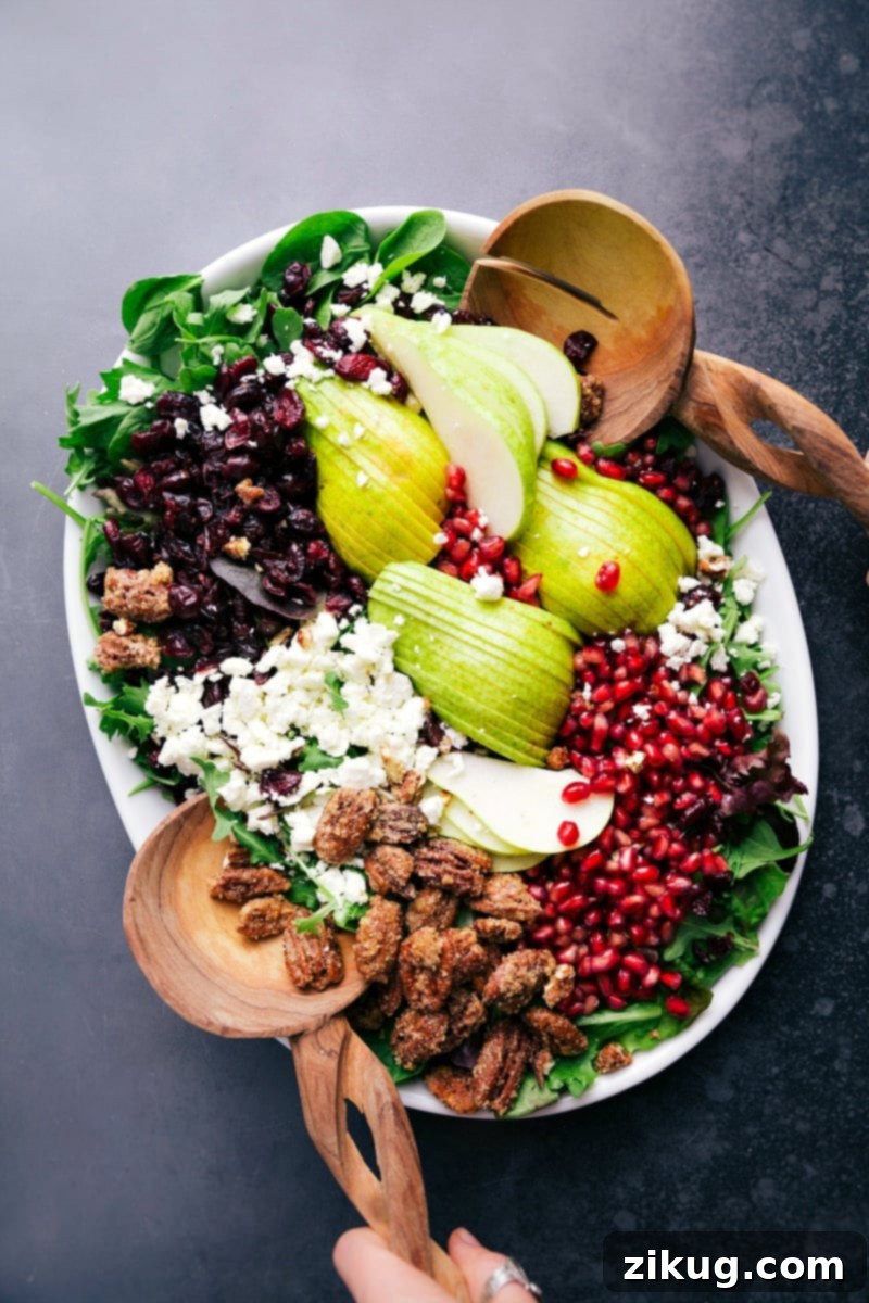 Organized Pear Salad Ingredients: A Visual Guide A pristine pear salad recipe laid out in a compartmentalized serving tray, showcasing each fresh ingredient arranged neatly before mixing.