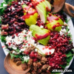 Vibrant Pear Pomegranate Salad 2 A salad using pears, about to be tossed and served, making it a delicious and healthy side dish.