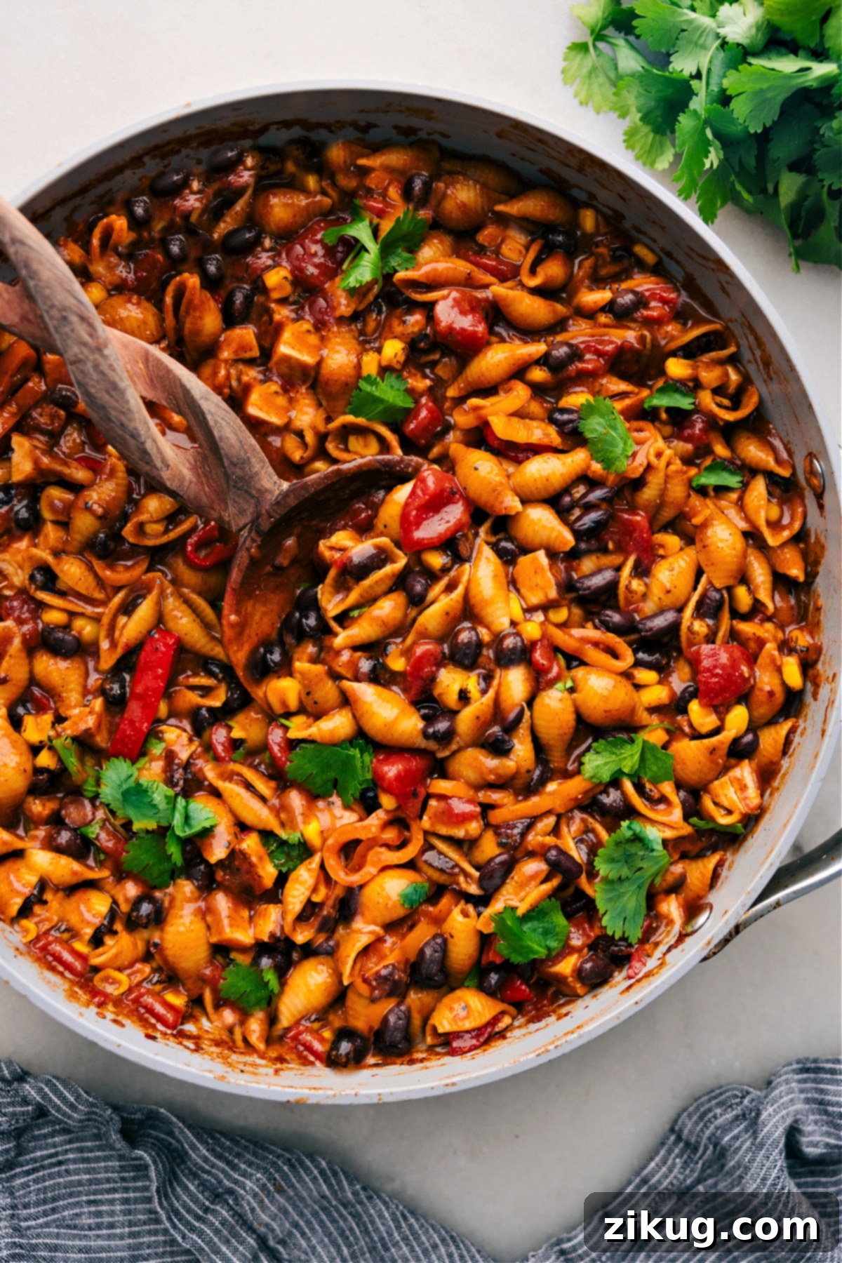 Delicious Enchilada Pasta served directly from the skillet, garnished and ready to be enjoyed.
