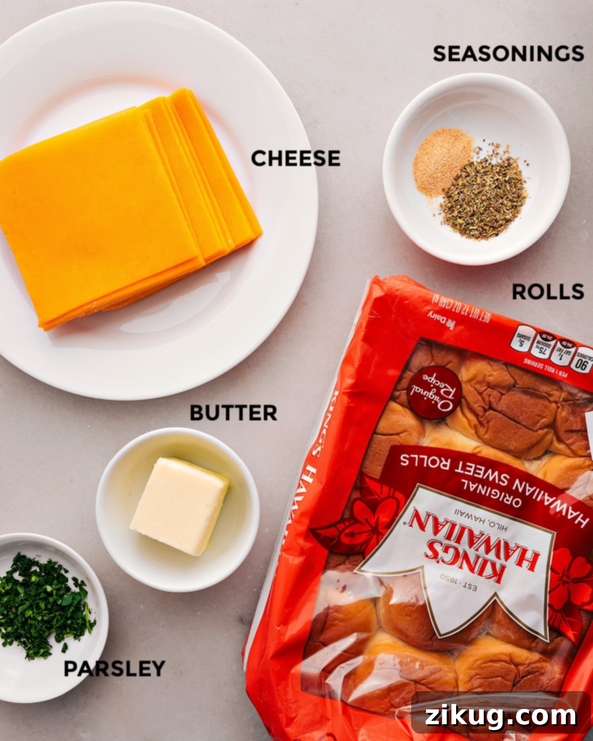 Ingredients In Mini Grilled Cheese All the ingredients in this recipe are prepped for easy assembly: rolls, butter, cheese, parsley, and seasonings.