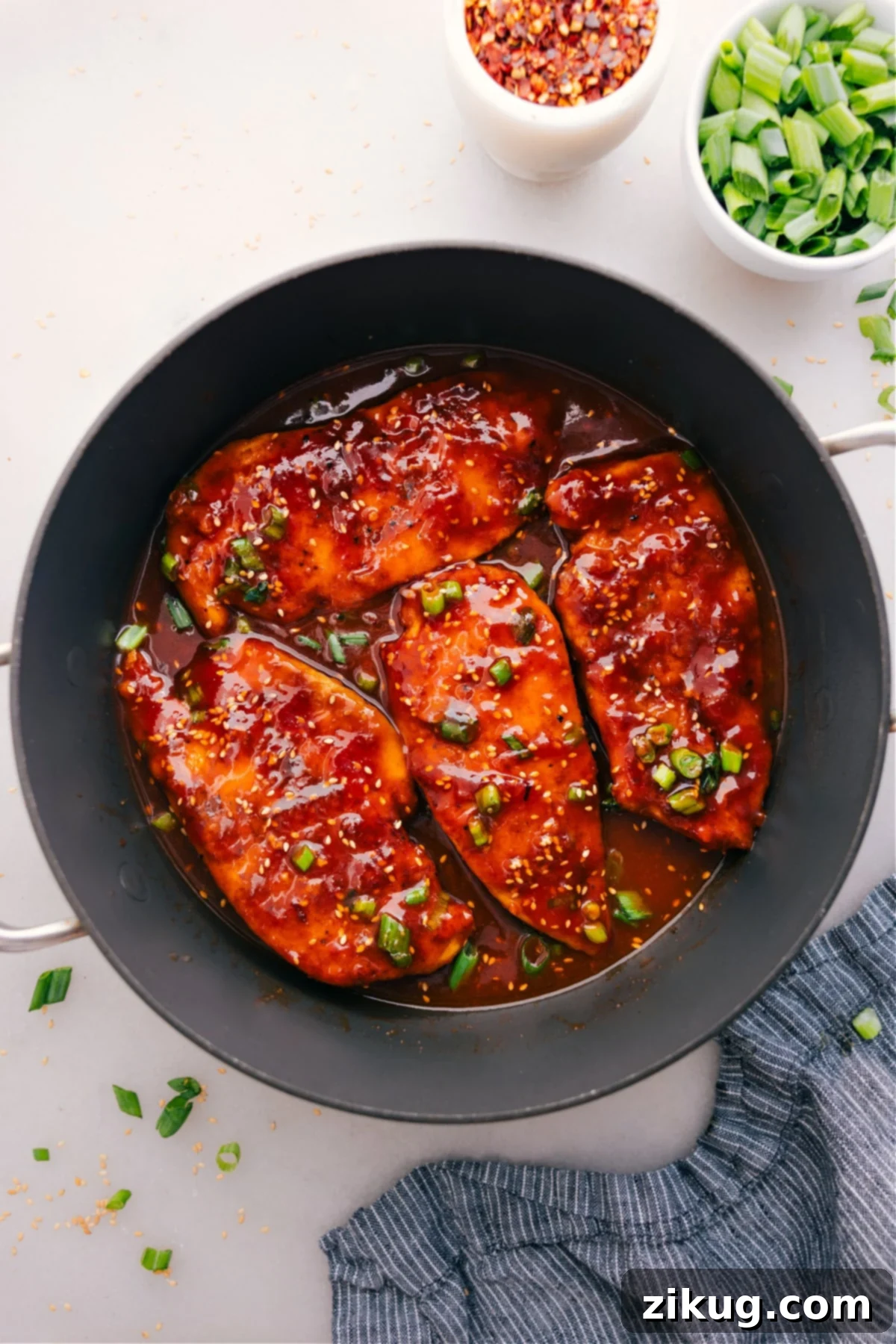 The Best And Easiest Honey Garlic Chicken Honey Garlic Chicken cooks in a skillet and gets a topping of green onions.