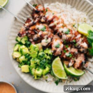 Appetizing Bang Bang Chicken Skewers drizzled with creamy sauce.