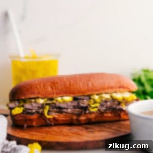 Delicious Italian Beef Sandwich prepared with slow-cooked beef and provolone cheese.