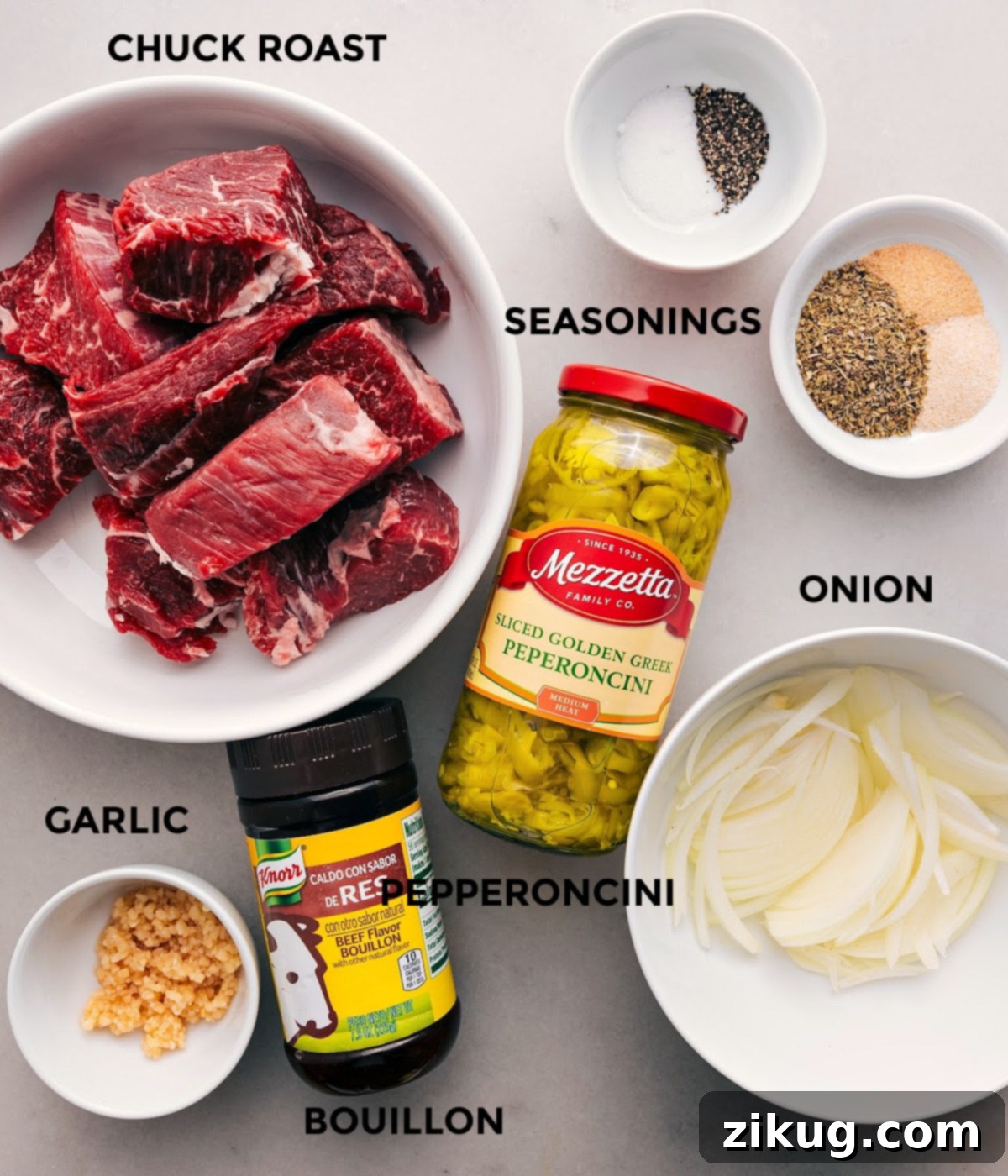 Key Ingredients for Italian Beef Sandwich All the essential ingredients for Italian Beef Sandwiches laid out: beef, pepperoncini, onion, seasonings, garlic, and bouillon.