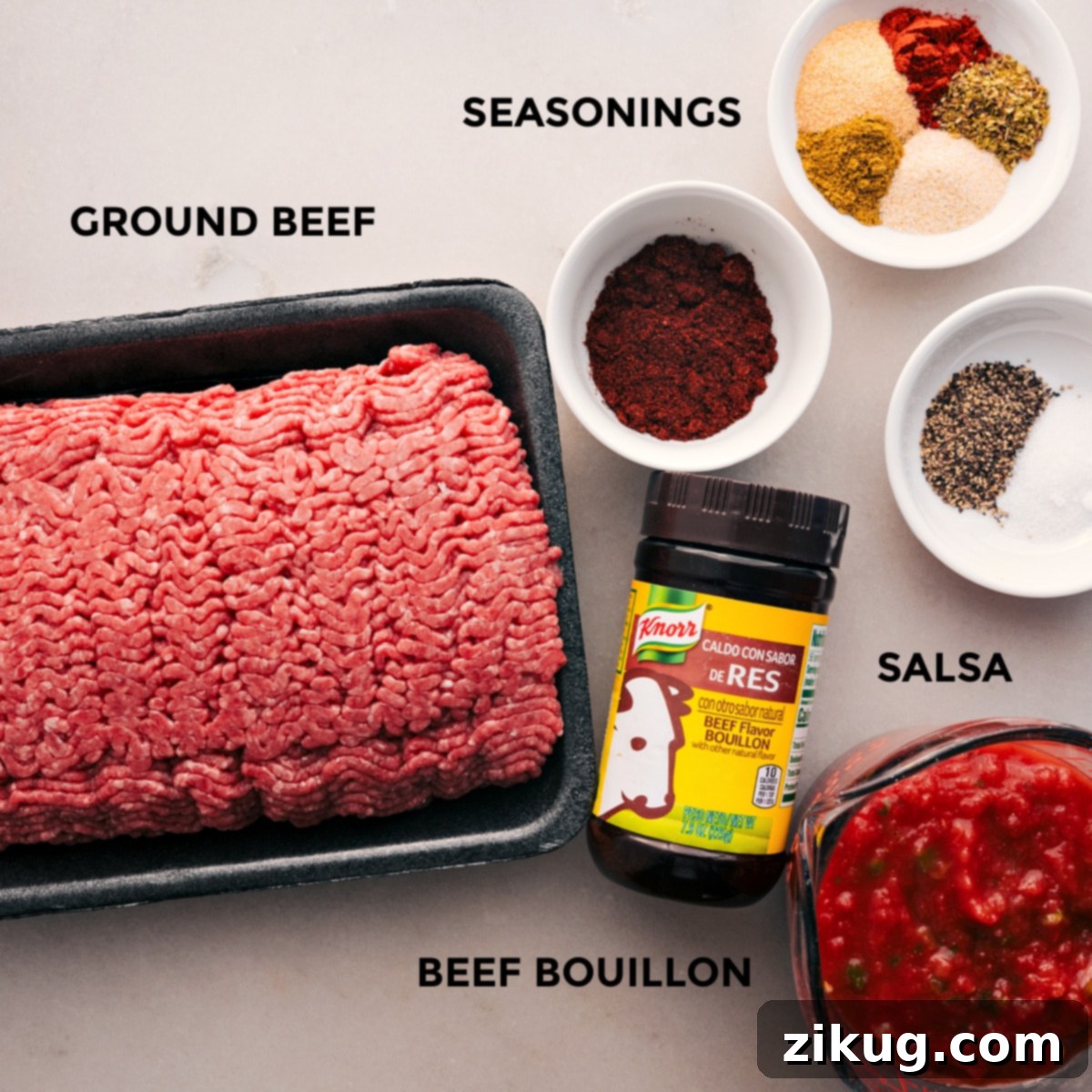 Ingredients In Crockpot Taco Meat All the fresh ingredients for Crockpot Taco Meat laid out, including ground beef, a variety of seasonings, and a bowl of mild salsa.