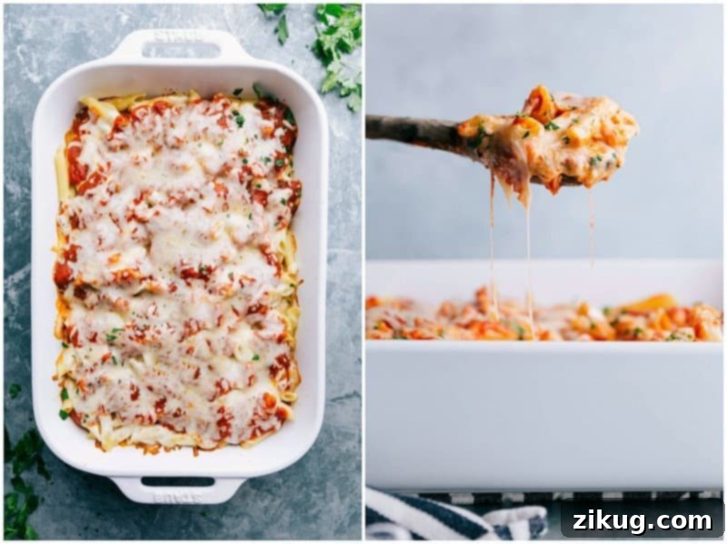 Finished Red and White Sauce Pasta Casserole - Melted Cheese and Fresh Herbs, Ready to Serve Finished casserole dish topped with melted cheese and fresh herbs, with a spoonful being taken out to showcase its delicious texture and flavor.