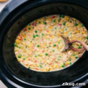 Crockpot Chicken Pot Pie Serving Suggestion A bowl of creamy Crockpot Chicken Pot Pie, topped with a golden-brown biscuit, garnished with fresh herbs, ready to be enjoyed.