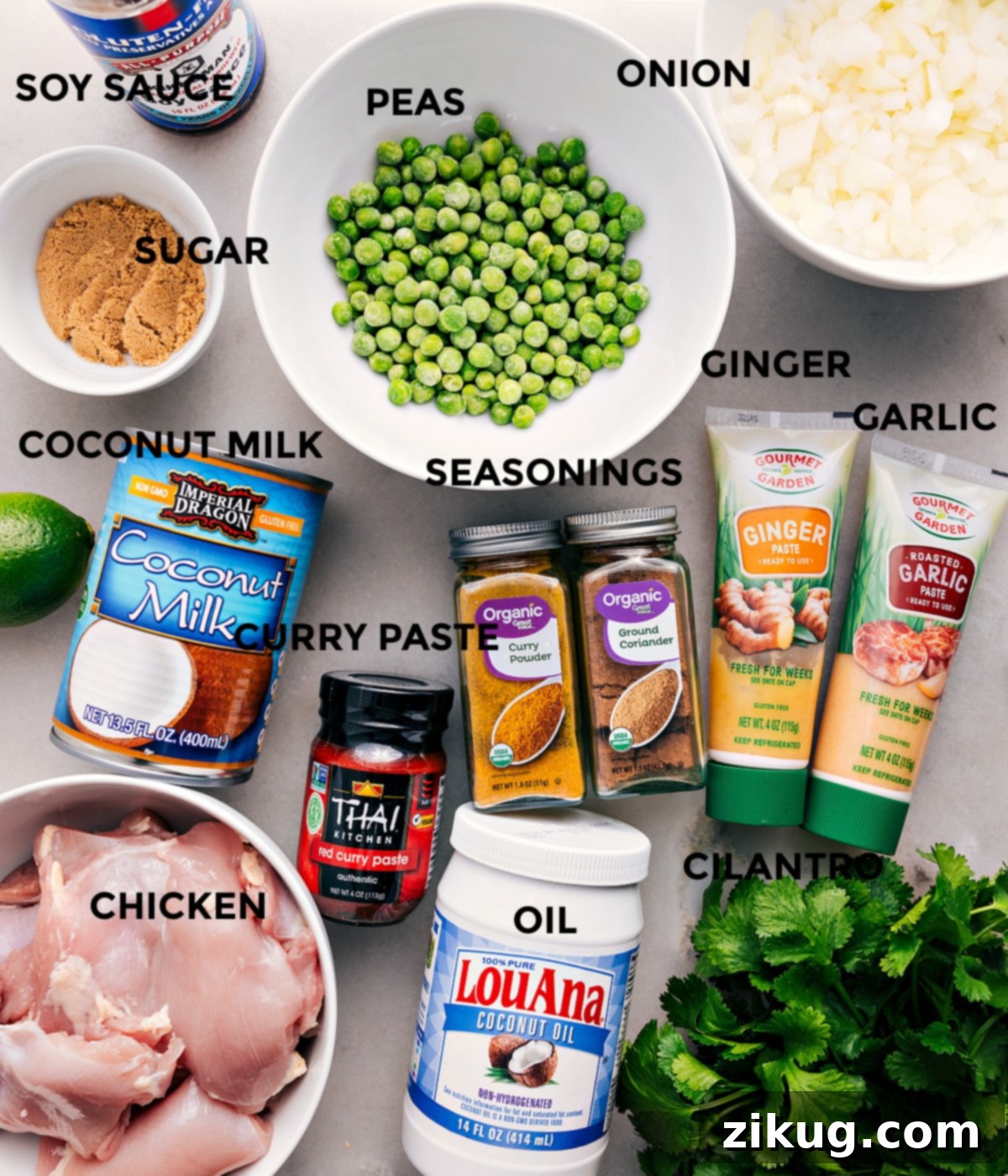 All the ingredients are prepped for easy assembly—peas, onion, garlic, ginger, seasonings, soy sauce, sugar, coconut milk, red curry paste, meat, oil, and cilantro.