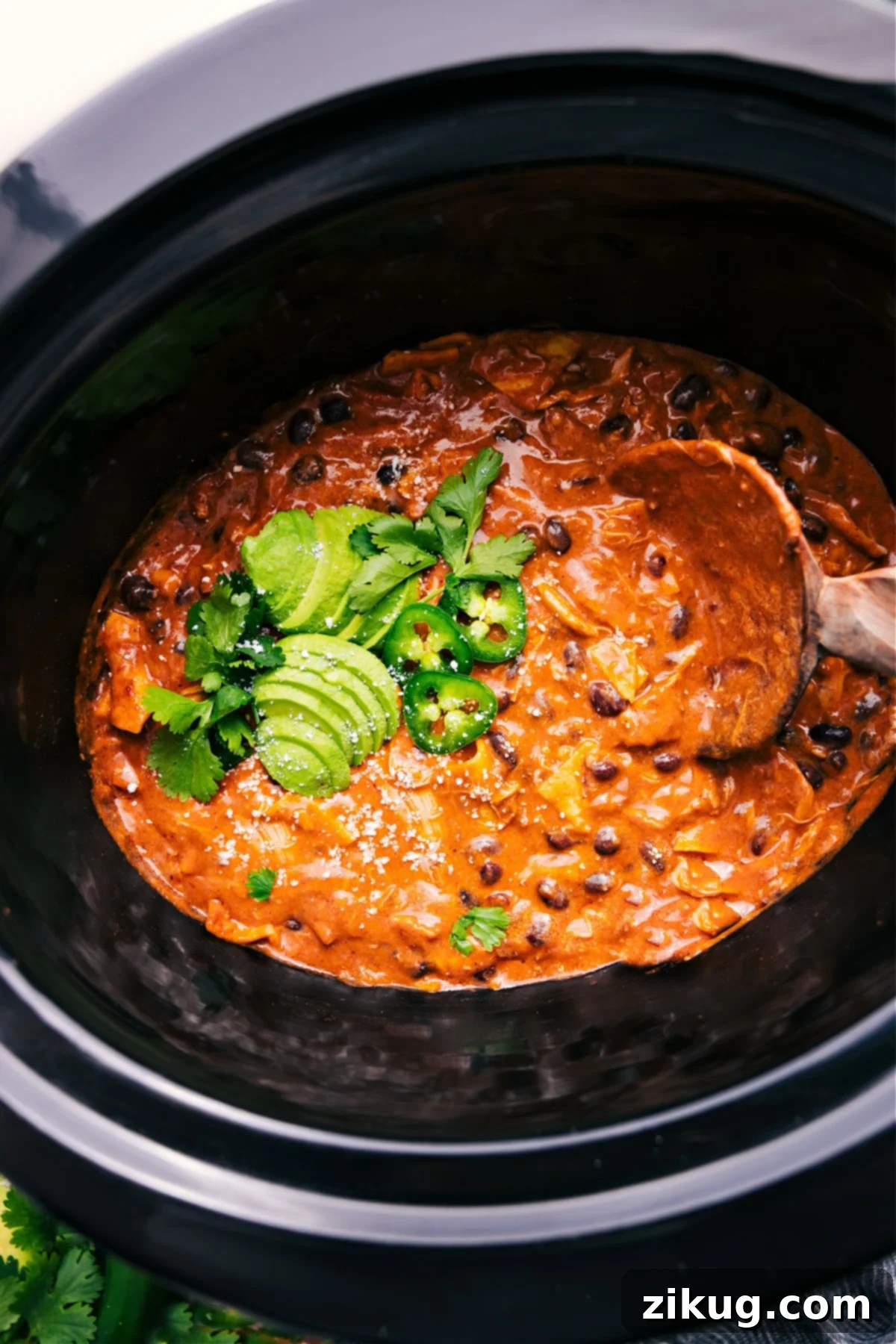 The Best Crockpot Chicken Enchilada Casserole: A Family Favorite Delicious Crockpot Chicken Enchilada Casserole bubbling in the slow cooker, ready to serve.