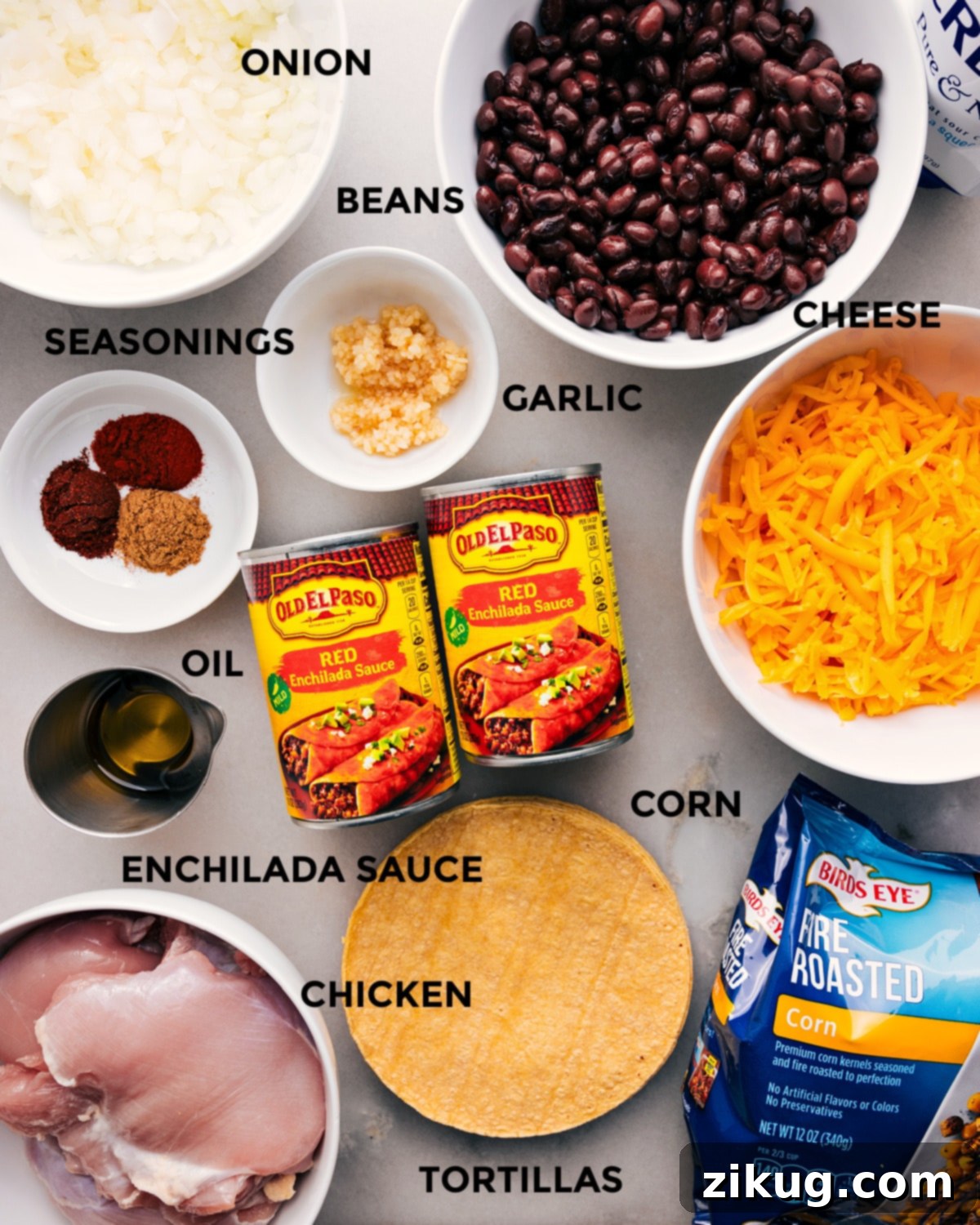 Essential Ingredients For Your Cheesy Crockpot Chicken Enchilada Casserole A vibrant display of all fresh ingredients for Crockpot Chicken Enchilada Casserole, including chicken, enchilada sauce, corn tortillas, black beans, corn, cheese, and spices.