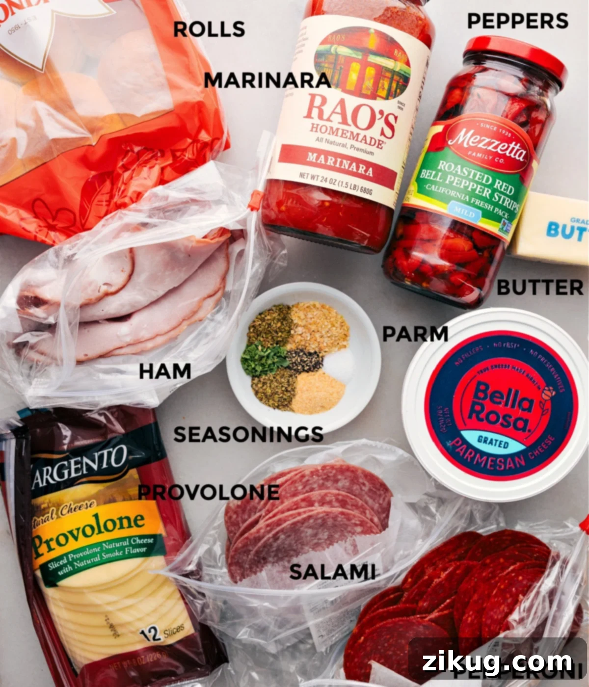 The Essential Sliders Ingredients Ingredients for Italian Sliders laid out: Hawaiian rolls, various deli meats, Provolone cheese, roasted red peppers, and butter mixture.