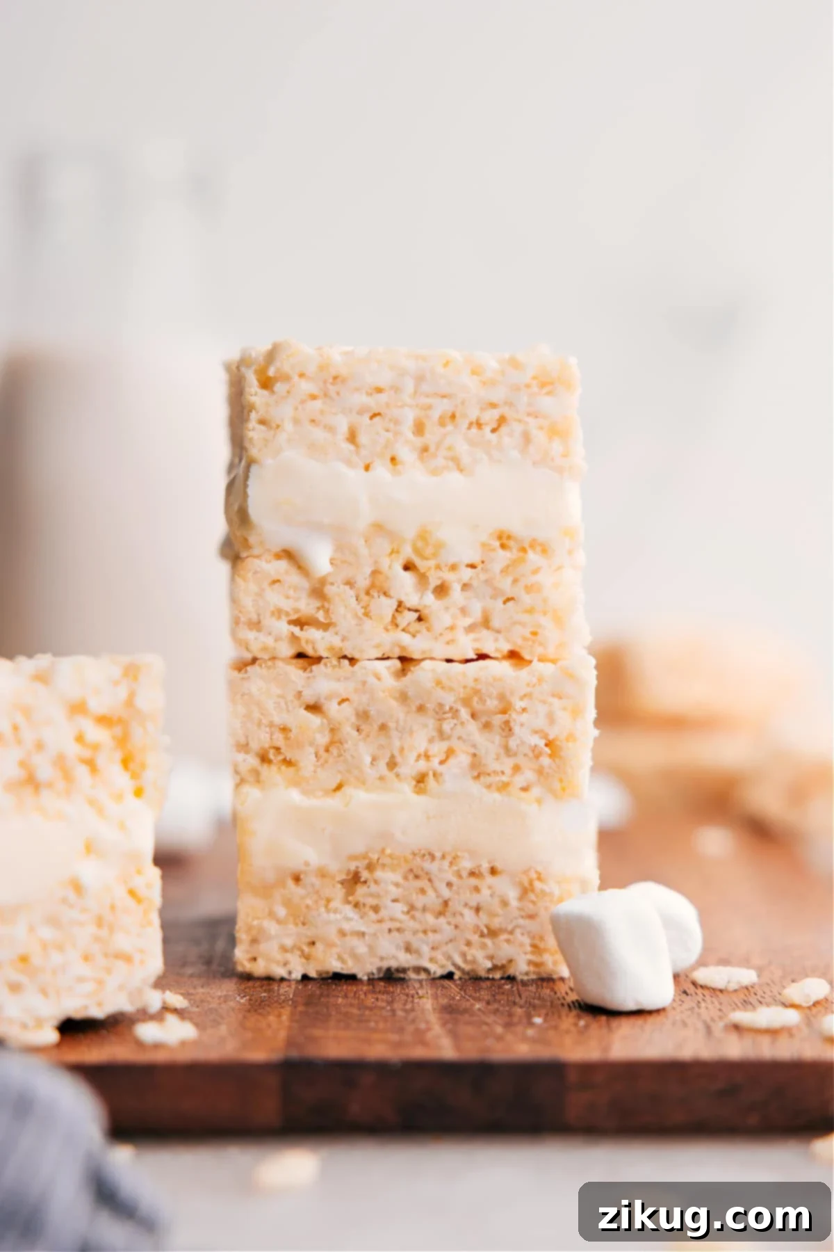 The Best Rice Krispie Treats Ice Cream Sandwiches Stacked homemade Rice Krispies Treats Ice Cream Sandwiches, showing the crispy exterior and creamy ice cream filling, ready to be enjoyed.