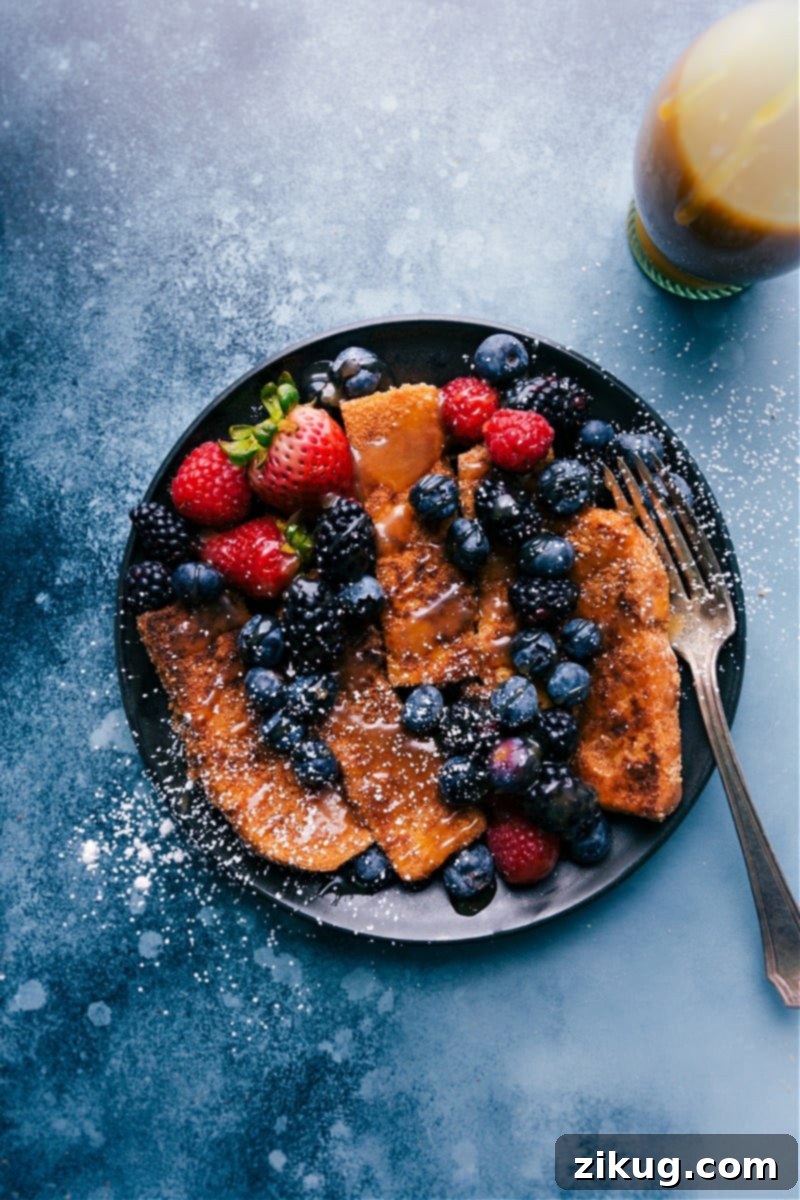 Cinnamon-sugar French Toast Sticks are dredged in an easy egg mixture and crushed Cinnamon Toast Crunch® cereal. This easy breakfast option is delicious, kid friendly, and easy to make! Recipe via chelseasmessyapron #breakfast #dessert #quick #easy #simple #berries #syrup #best #cinnamohn #Frenchtoast #sticks Crispy Cinnamon-Sugar French Toast Sticks coated in Cinnamon Toast Crunch cereal, ready to be served for an easy and delicious breakfast.