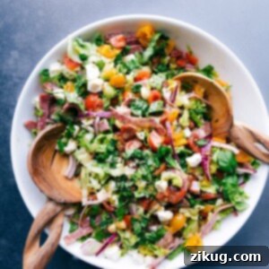 The Ultimate Italian Chopped Salad 3 Colorful and vibrant Italian chopped salad with wooden serving spoons in the bowl.