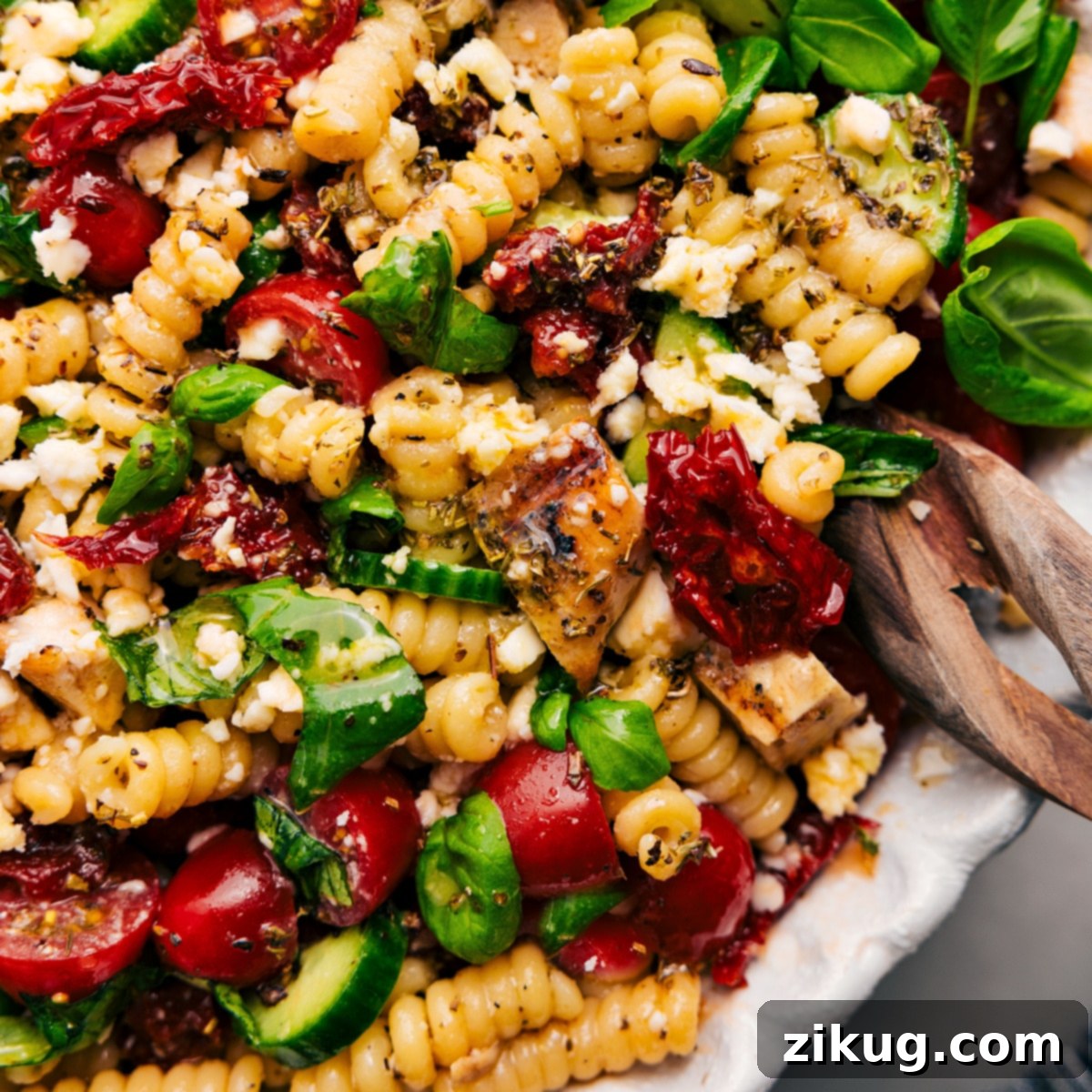 Marry Me Chicken Pasta Salad: A Perfect Weeknight Dinner or Side A large bowl filled with the colorful and flavorful Marry Me Chicken Pasta Salad, perfectly tossed with its dressing, ideal for a weeknight dinner or side.