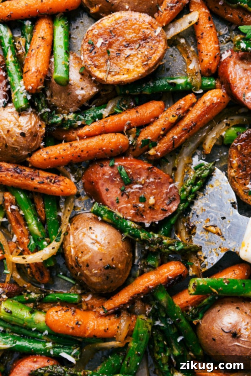 Finished One-Pan Potatoes and Sausage A mouthwatering assortment of vegetables, sausage, and spices in the finished one-pan potatoes and sausage dish, ready to be savored.