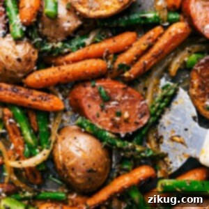 Golden Pan Roasted Sausage and Spuds 2 A mouthwatering assortment of vegetables, sausage, and spices in the finished meal, ready to be savored.
