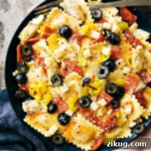 A vibrant bowl of Ravioli Salad, showcasing the diverse ingredients and rich colors
