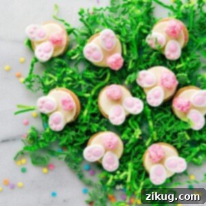Bunny Bum Cookies: golden Oreo cookies adorned with fluffy marshmallow tails and tiny bunny feet decorations.