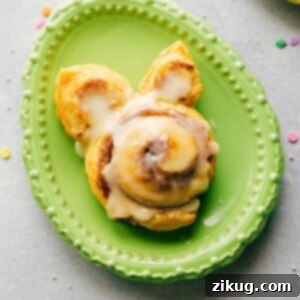 Freshly baked Bunny Cinnamon Rolls with frosting, shaped like cute bunnies for Easter breakfast.