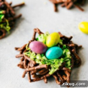 Crunchy Easter Egg Nests made with chocolate and chow mein noodles, filled with green coconut and robin egg M&M's.