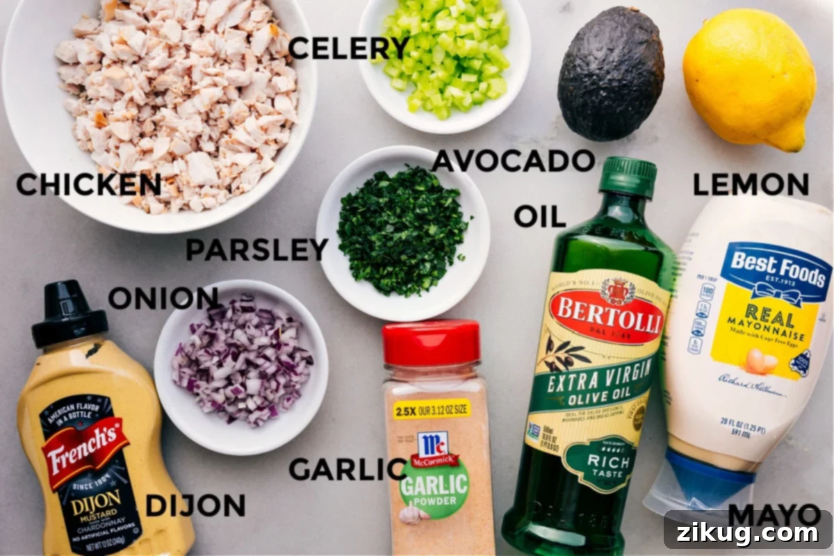 Ingredients In Chicken Avocado Sandwich All the fresh ingredients for the Chicken Avocado Sandwich recipe laid out: cooked chicken, ripe avocados, crisp celery, red onion, fresh parsley, lemon, mayonnaise, Dijon mustard, olive oil, and garlic powder.