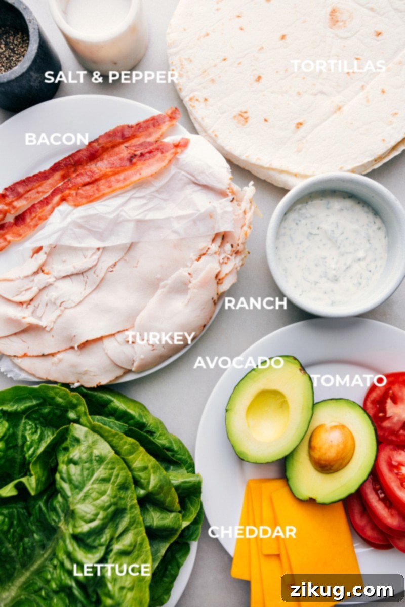 Fresh ingredients for Turkey Avocado Wraps laid out on a table