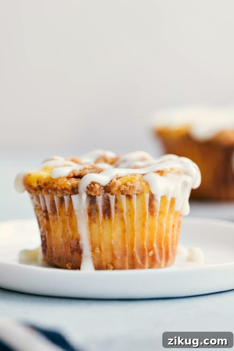 Perfectly Glazed Cinnamon Roll Cupcake Close-up view of a single frosted Cinnamon Roll Cupcake