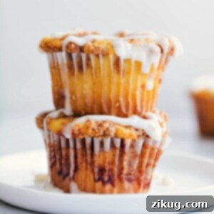 Cinnamon Roll Cupcakes Recipe Image A beautifully decorated Cinnamon Roll Cupcake with a swirl of cream cheese glaze