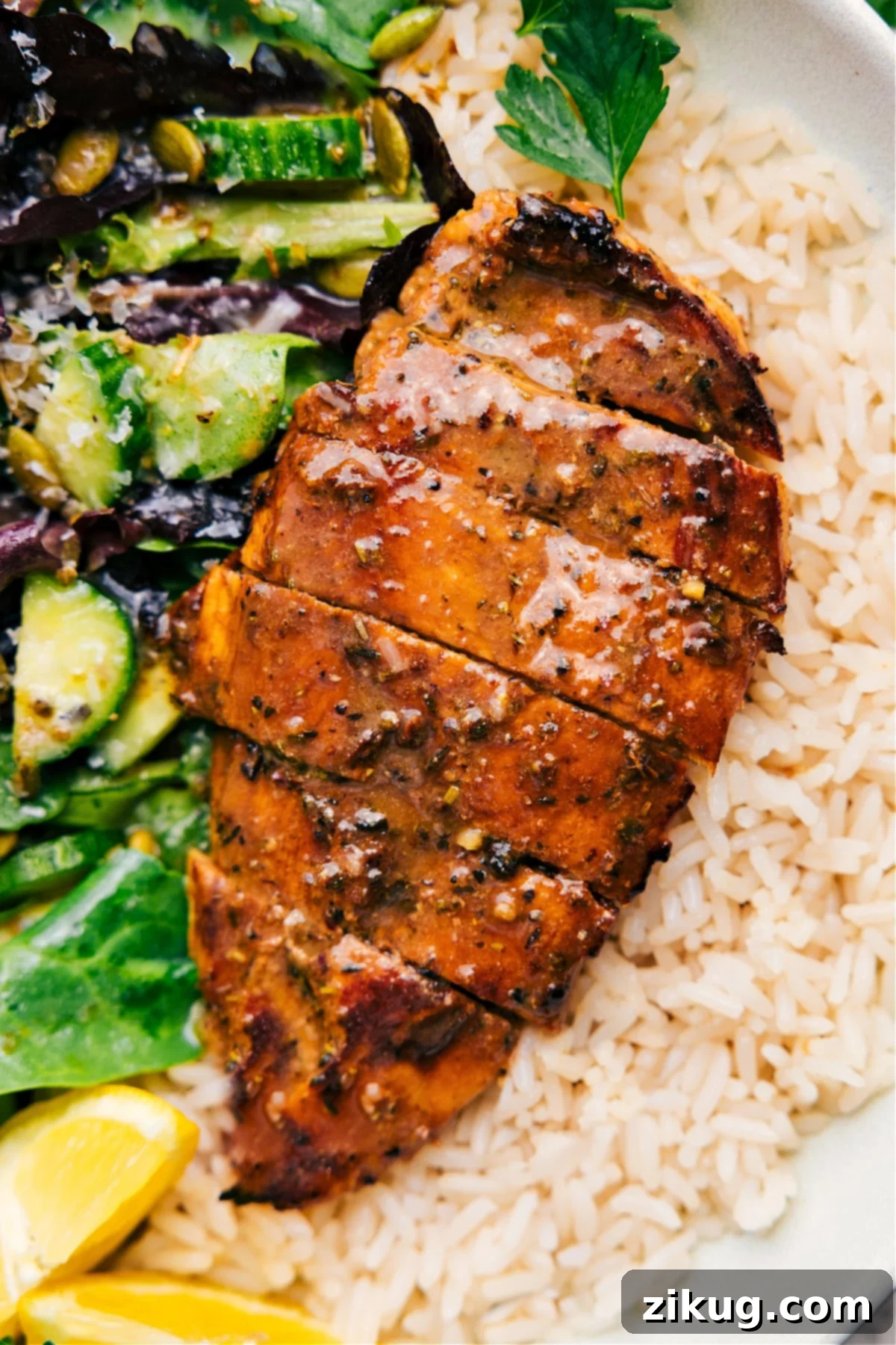 The Best Balsamic Chicken Marinade Recipe Balsamic Chicken Marinade served over a bed of rice with a fresh side salad, ready to enjoy.