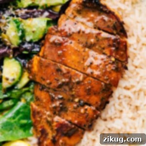 Flavor-Packed Balsamic Chicken Marinade 3 Delicious Balsamic Chicken Marinade on a plate with rice and salad.