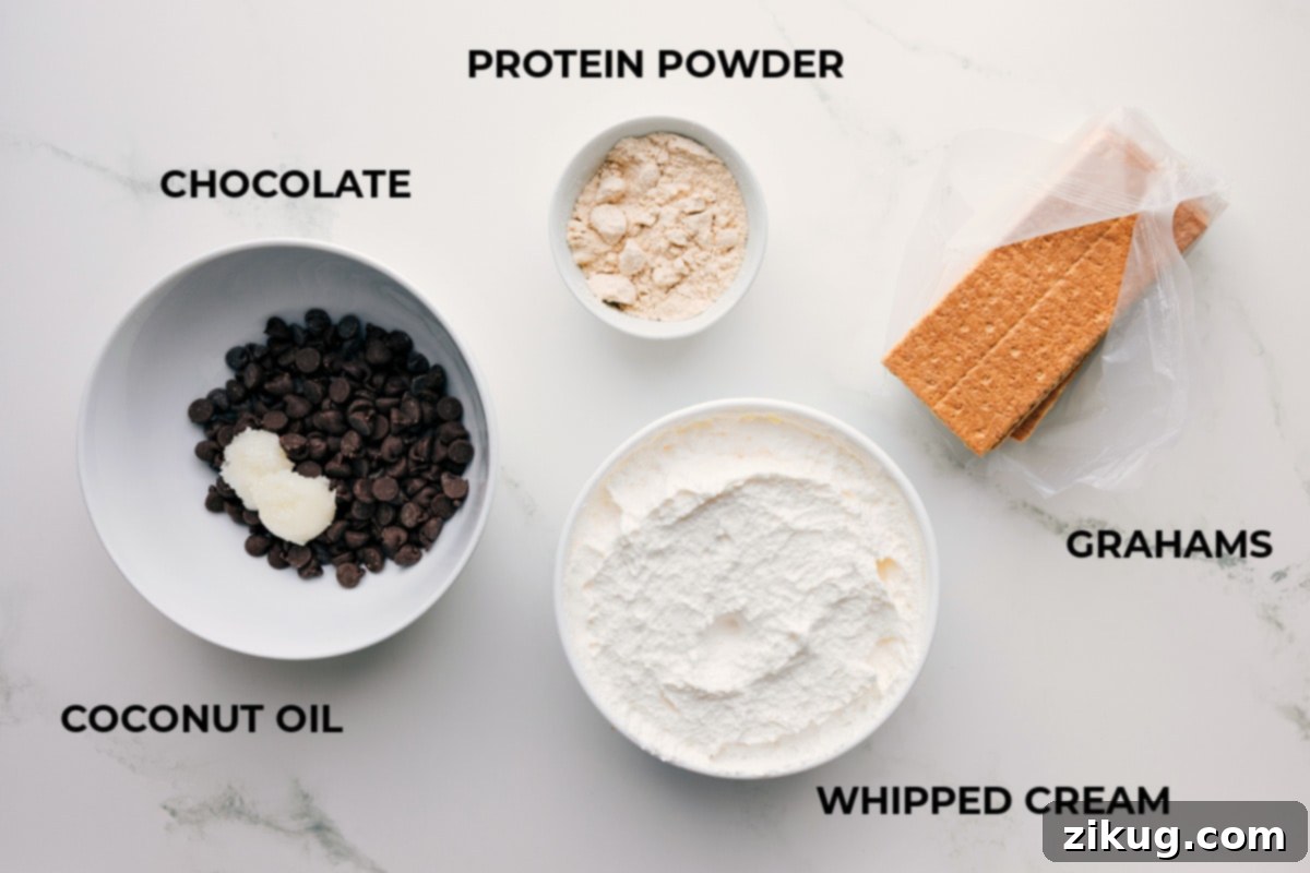 A beautifully arranged collection of all the essential ingredients for making Frozen Protein S'mores, including golden graham crackers, rich chocolate chips, creamy whipped topping, and a container of vanilla protein powder, set against a rustic background.