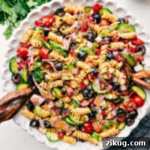 A close-up of the finished Italian Pasta Salad in a stylish bowl, perfectly garnished.