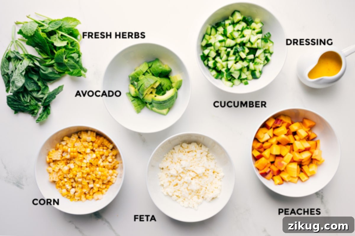 Key Ingredients for a Delicious Peach Feta Salad All the fresh ingredients for Peach Feta Salad laid out and prepped on a wooden board, including sliced peaches, grilled corn kernels, diced cucumber, avocado, crumbled feta, fresh basil, and the citrus dressing.