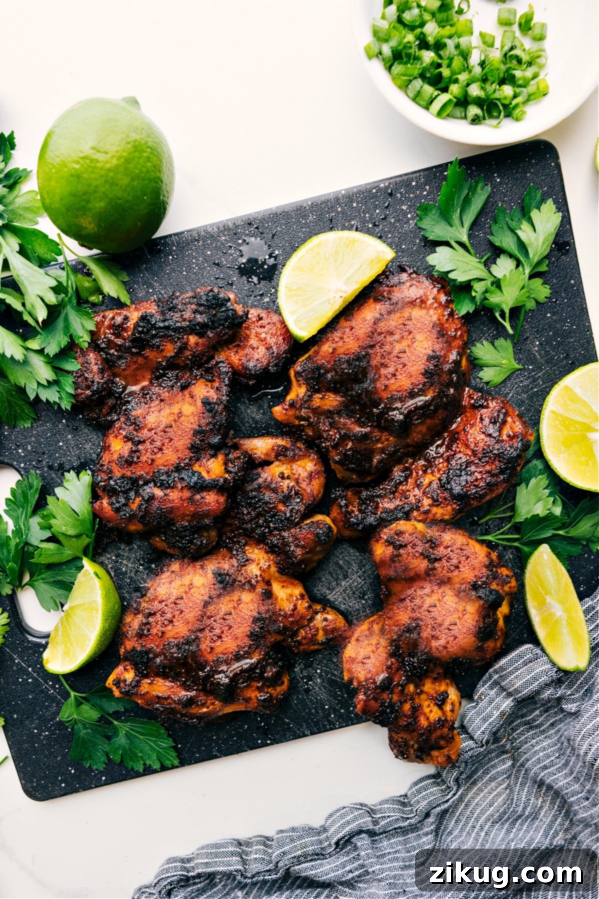 Juicy And Flavorful Baked Chicken Thighs Perfectly baked boneless chicken thighs, golden-brown and juicy, ready to be sliced and served for a delicious meal.