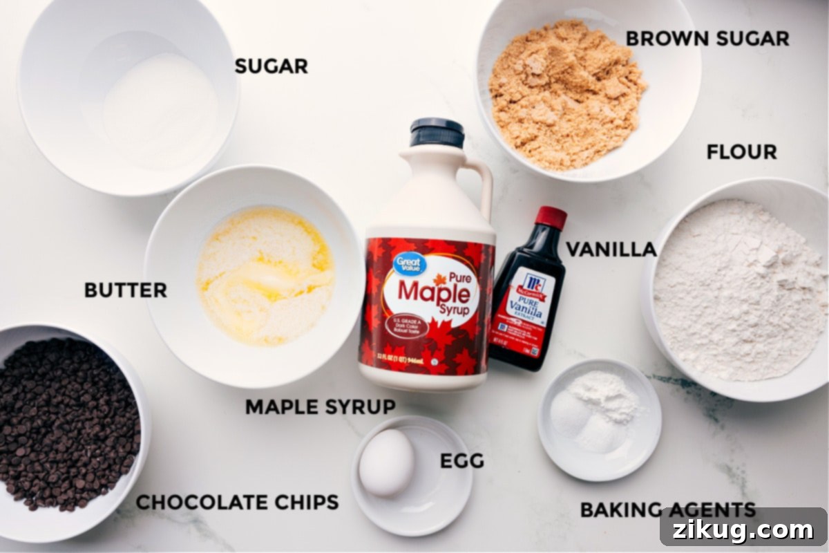 Ingredients In Tiny Chocolate Chip Cookies All the essential ingredients for tiny chocolate chip cookies perfectly prepped and laid out for easy assembly, including flour, sugars, butter, egg, vanilla, maple syrup, leavening agents, and a generous amount of mini chocolate chips.