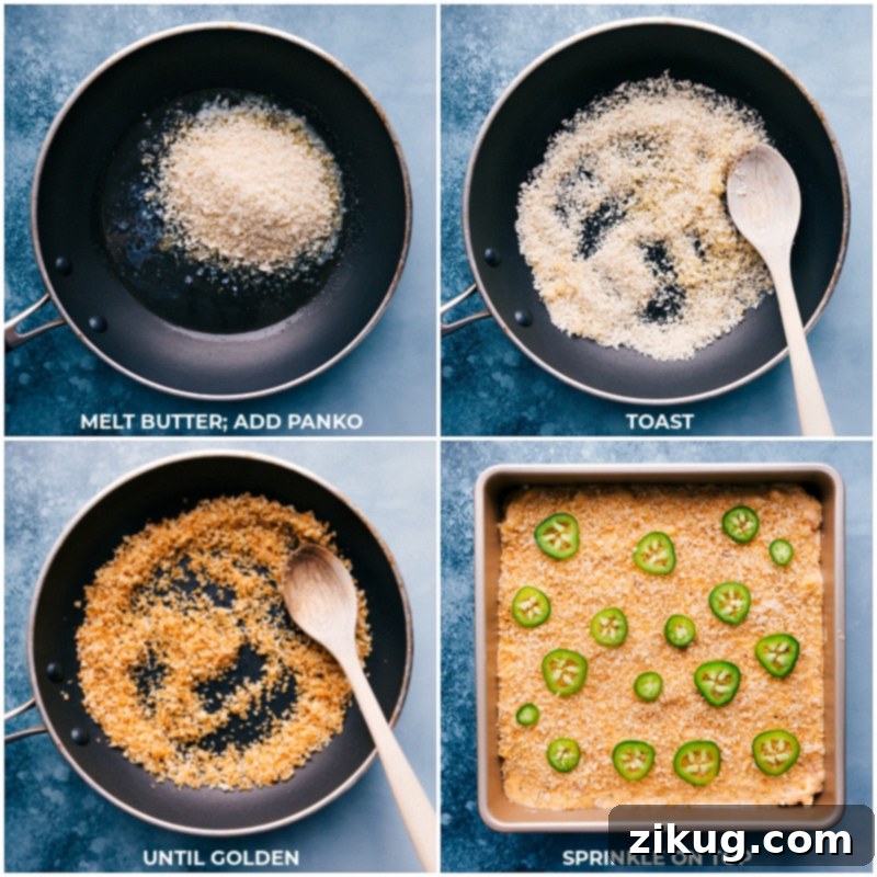 A close-up shot of Panko breadcrumbs being sprinkled evenly over the top of the Jalapeño Popper Mac and Cheese in a baking dish, prior to baking.