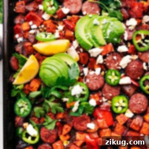 Close-up of Sheet Pan Hot Honey Sausage & Veggies on a plate, showcasing the caramelized glaze and vibrant ingredients.