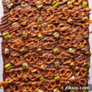 A close-up of a serving of Caramel Apple Bark, showcasing its delicious layers and textures.