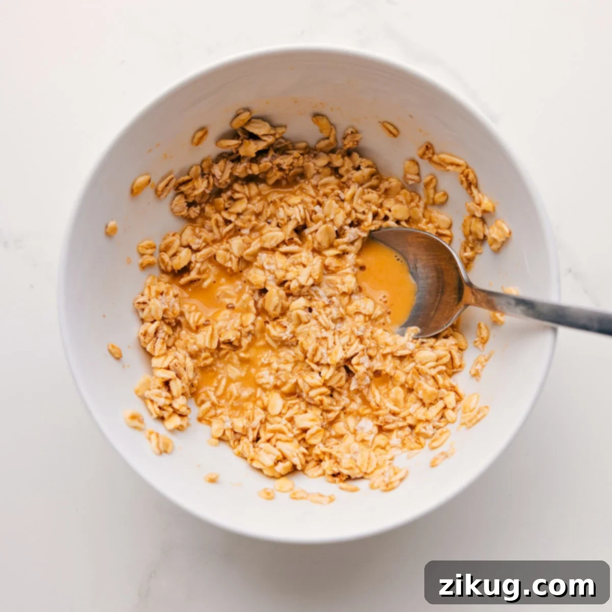 Flavorful And Delicious Princess Diana's Breakfast Recipe Preparation Oats are mixed with fresh orange juice, a pinch of salt, and vanilla extract, then left to chill overnight for Princess Diana's Breakfast recipe, showcasing the simple preparation.