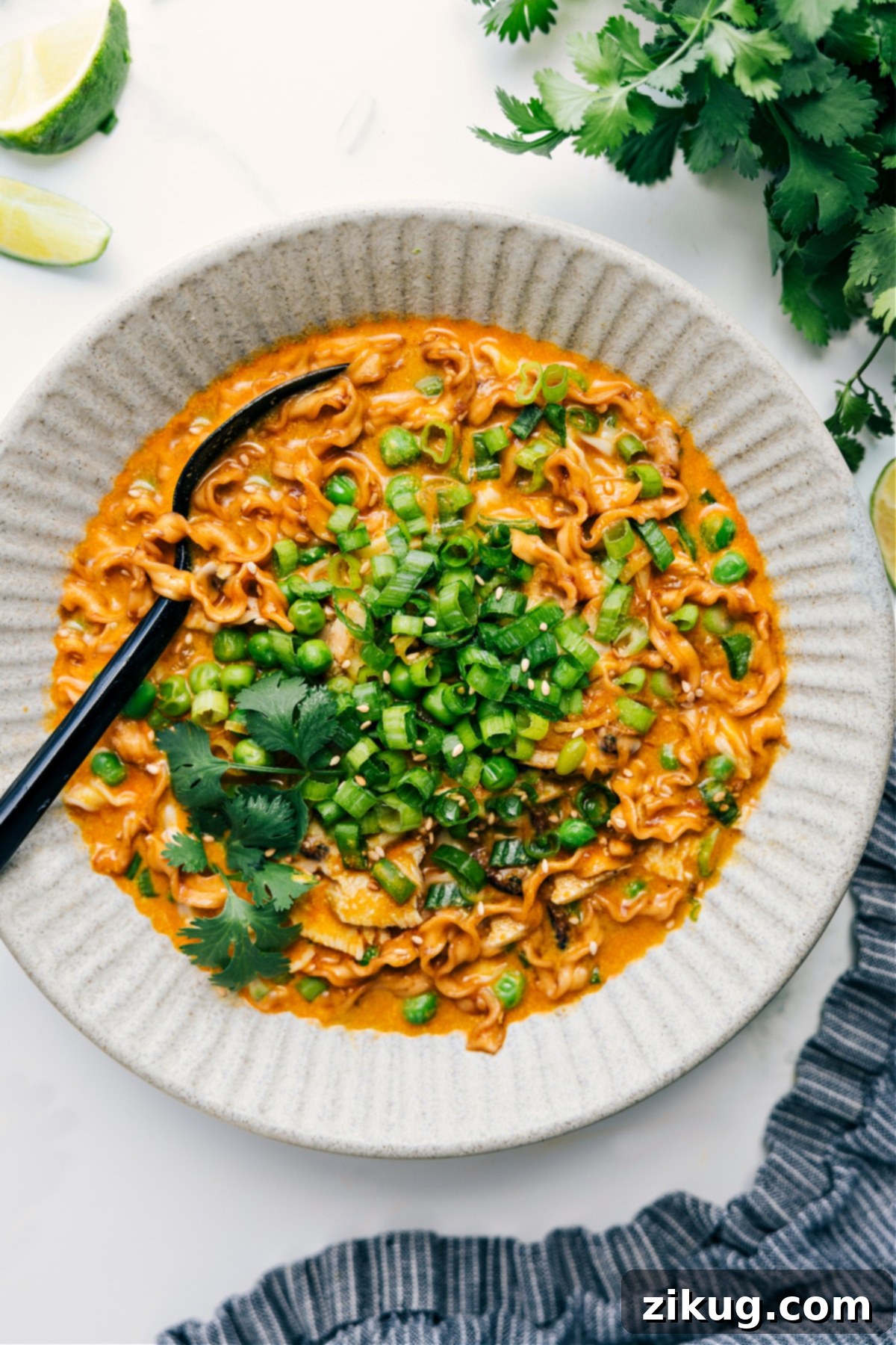 Trader Joe’s curry noodle soup recipe with squiggly noodles.
