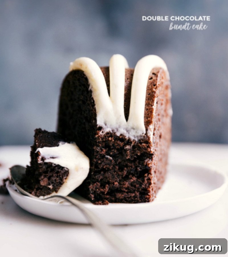 Indulgent Slice of Double Chocolate Bundt Cake Slice of luscious double chocolate bundt cake with a spoonful about to be enjoyed.