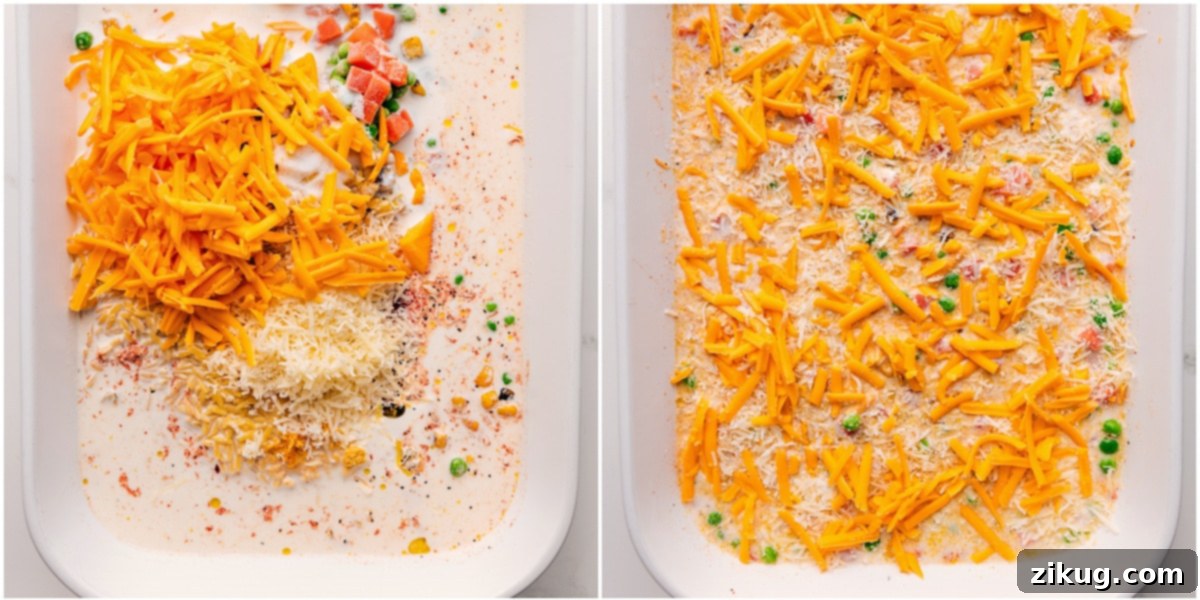 Golden Chicken Orzo Casserole 3 Overhead shot showcasing the partially assembled Chicken Orzo Bake, with liquids and initial vegetables mixed in, topped with a layer of cheese, before baking. It highlights the simplicity of the 'dump-and-bake' process.